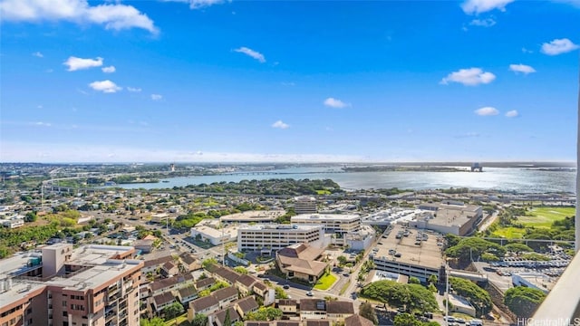 birds eye view of property with a water view and a city view