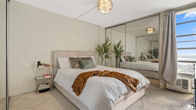 bedroom featuring light carpet