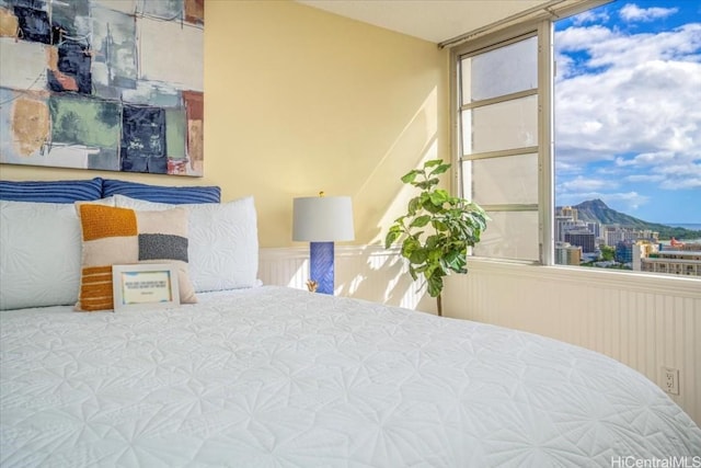 bedroom featuring a mountain view