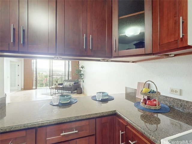 kitchen featuring stone counters