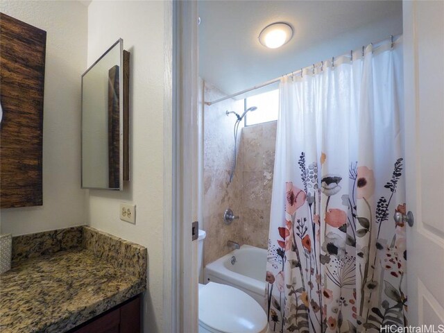 full bathroom featuring vanity, toilet, and shower / bathtub combination with curtain