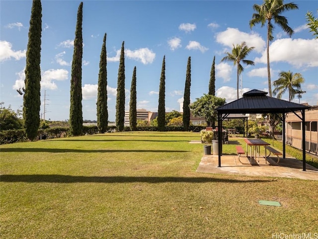 view of community featuring a gazebo and a lawn