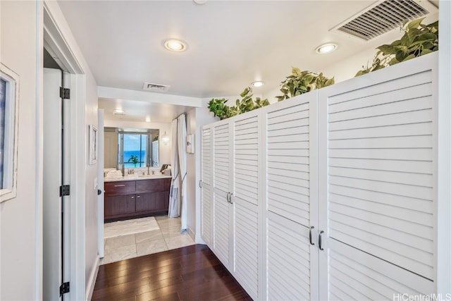 corridor featuring hardwood / wood-style floors