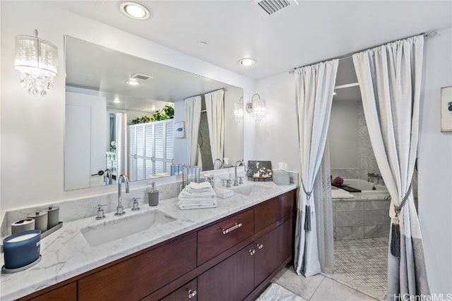 bathroom with vanity, an inviting chandelier, and tile patterned floors