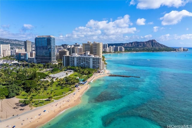 aerial view featuring a beach view and a water and mountain view