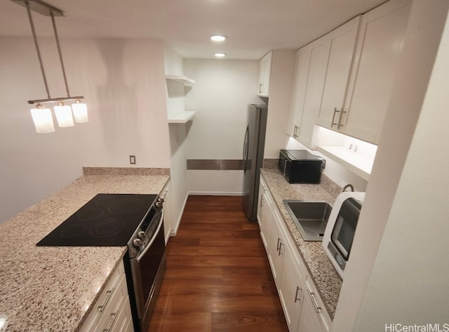 kitchen with light stone counters, open shelves, dark wood-style floors, white cabinetry, and stainless steel appliances