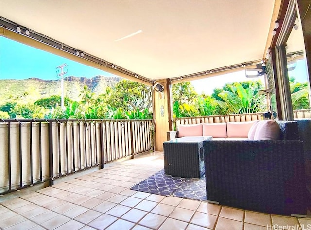 view of patio / terrace with outdoor lounge area and a mountain view