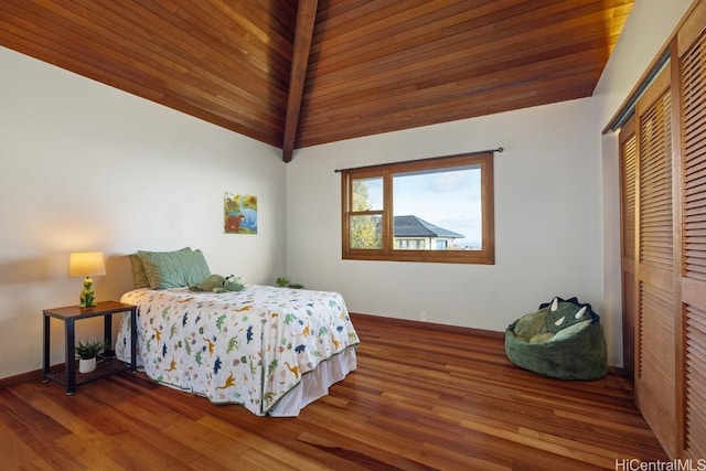 bedroom featuring a closet, hardwood / wood-style floors, wood ceiling, and vaulted ceiling