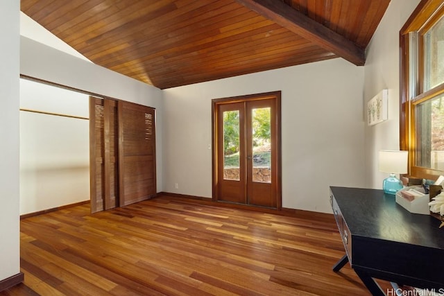 interior space with hardwood / wood-style floors, vaulted ceiling with beams, french doors, and wood ceiling