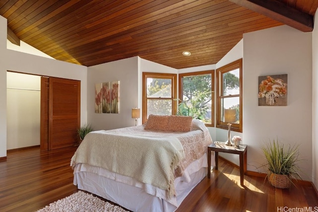 bedroom featuring vaulted ceiling with beams, dark hardwood / wood-style flooring, a closet, and wooden ceiling