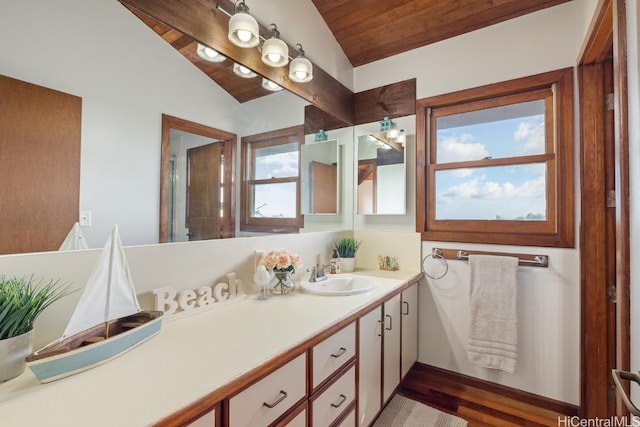 bathroom with hardwood / wood-style flooring, vanity, lofted ceiling, and wood ceiling