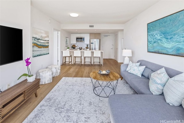 living room with light hardwood / wood-style floors