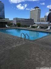 view of swimming pool with a patio area