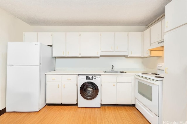 kitchen featuring washer / clothes dryer, white cabinetry, sink, and white appliances