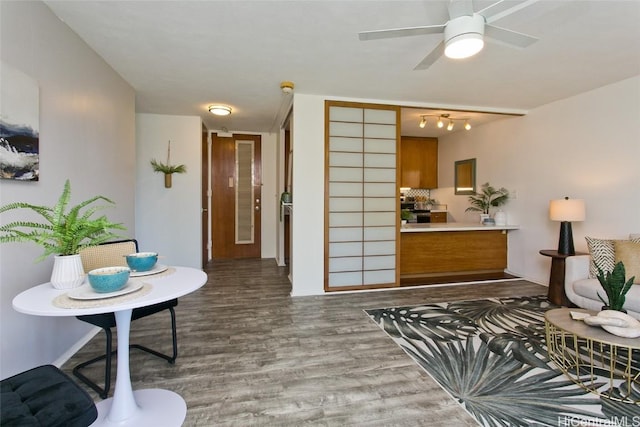 interior space featuring hardwood / wood-style flooring and ceiling fan