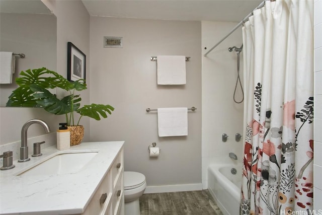 full bathroom featuring wood-type flooring, vanity, toilet, and shower / bath combination with curtain