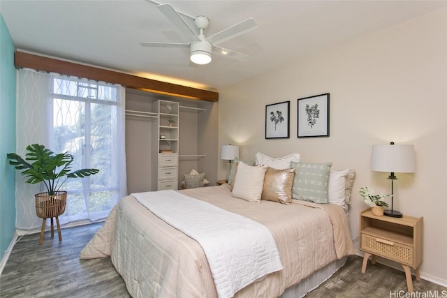 bedroom featuring access to exterior, ceiling fan, dark hardwood / wood-style flooring, and a closet