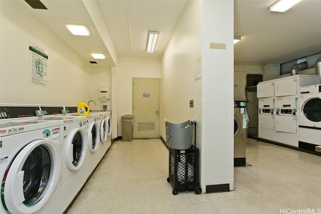 clothes washing area with washer and clothes dryer and stacked washer and clothes dryer