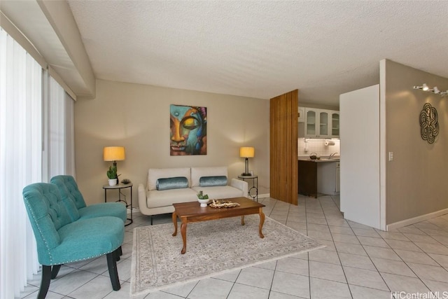 living room with light tile patterned floors and a textured ceiling