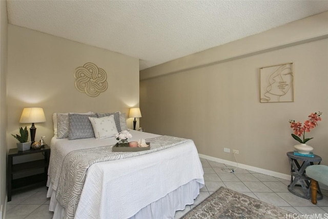 tiled bedroom with a textured ceiling