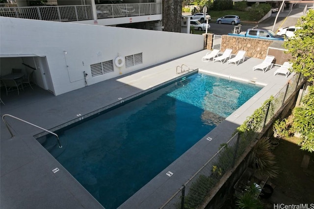 view of pool featuring a patio area