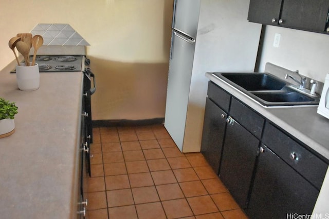 kitchen with sink and light tile patterned floors