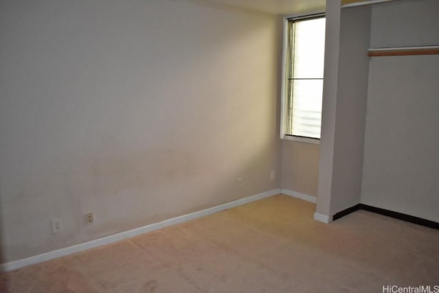 unfurnished bedroom with light carpet