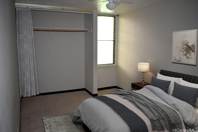 carpeted bedroom with a closet and ceiling fan