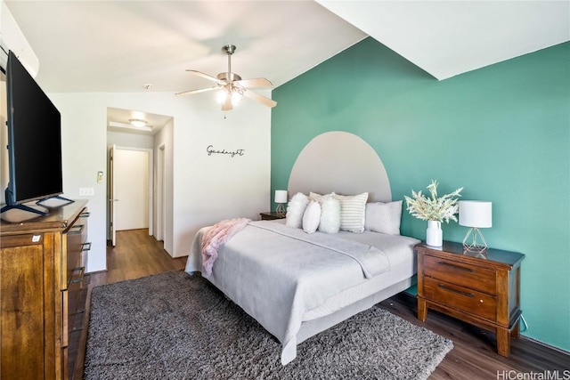 bedroom featuring ceiling fan, lofted ceiling, and dark wood-type flooring