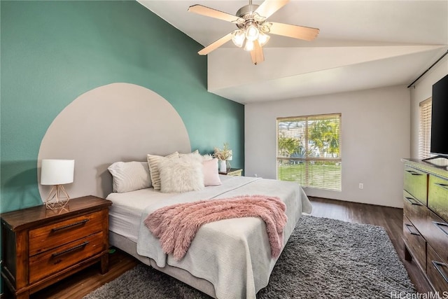 bedroom featuring lofted ceiling, ceiling fan, and dark wood-type flooring