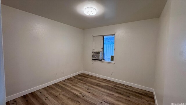 87-141 Kulahelela Pl, Waianae, HI 96792 - unfurnished room featuring wood finished floors, baseboards, and cooling unit