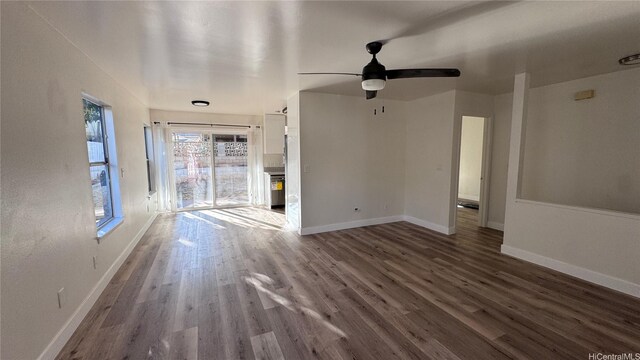 87-141 Kulahelela Pl, Waianae, HI 96792 - unfurnished living room with wood finished floors, baseboards, and a ceiling fan