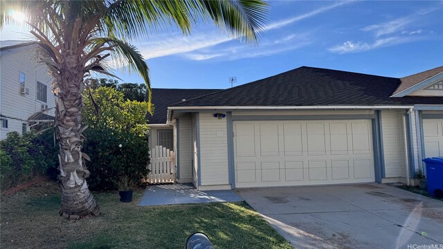 87-141 Kulahelela Pl, Waianae, HI 96792 - view of front of house featuring driveway, an attached garage, and roof with shingles