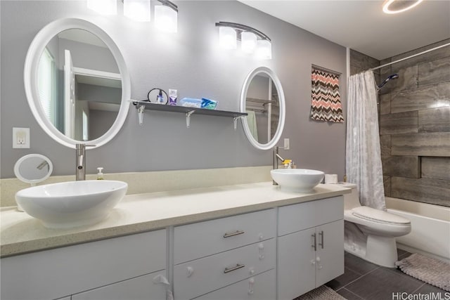 full bathroom with tile patterned flooring, vanity, shower / bath combo, and toilet