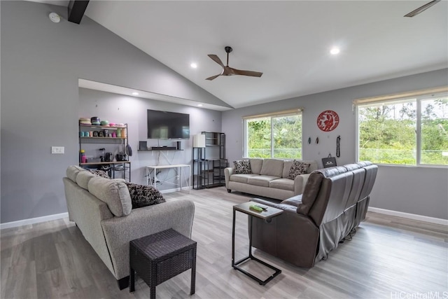 living room with beamed ceiling, light hardwood / wood-style floors, high vaulted ceiling, and ceiling fan