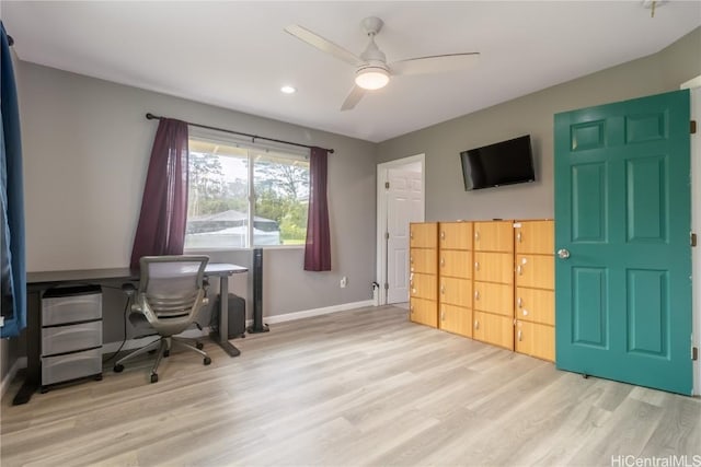 office space with light wood-type flooring and ceiling fan