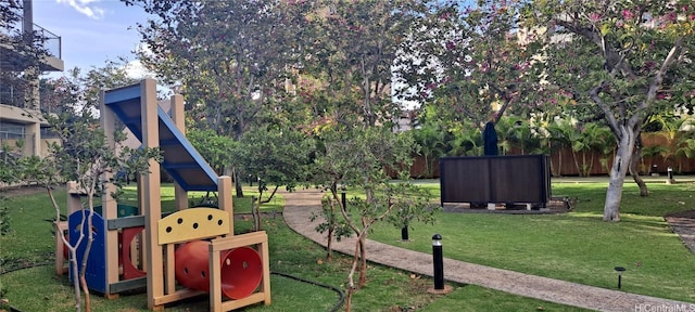 view of playground with a lawn