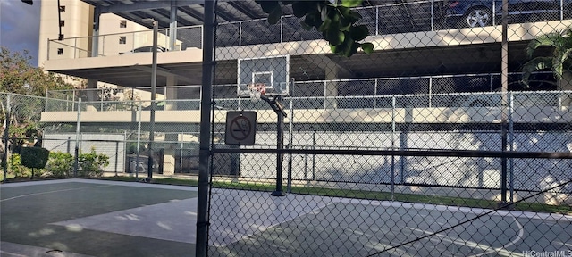 view of sport court featuring community basketball court and fence