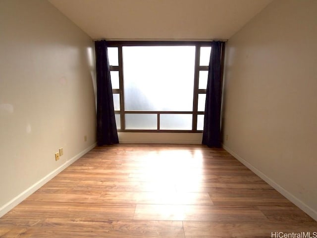 spare room with light hardwood / wood-style floors