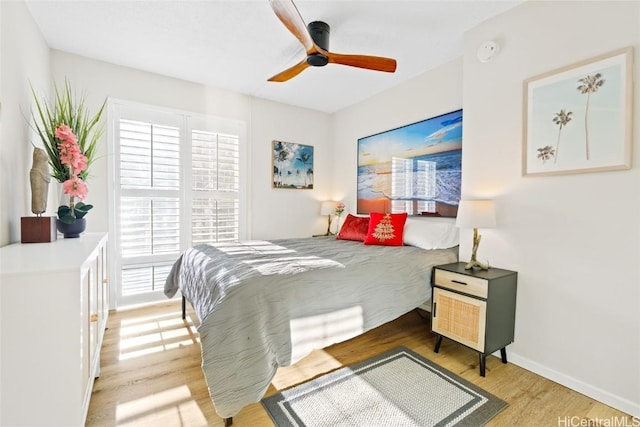 bedroom with ceiling fan and light wood-type flooring