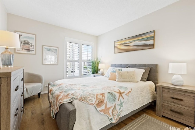 bedroom with hardwood / wood-style flooring