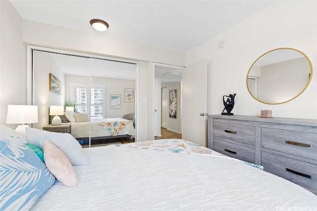 bedroom featuring wood-type flooring and a closet