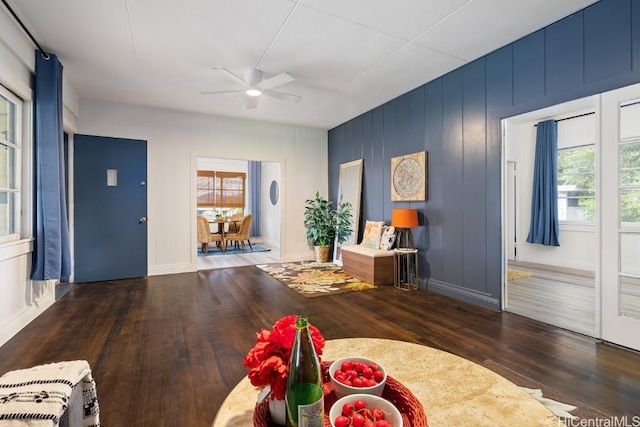 unfurnished dining area featuring heating unit, dark hardwood / wood-style floors, and ceiling fan