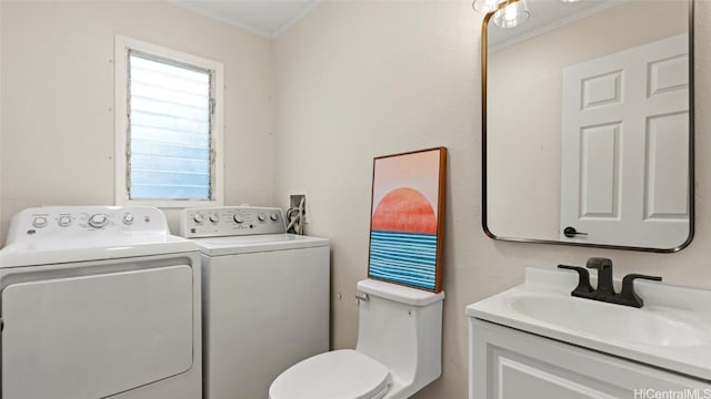 bathroom featuring vanity, separate washer and dryer, toilet, and crown molding