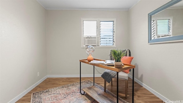 office space featuring wood-type flooring, cooling unit, and ornamental molding