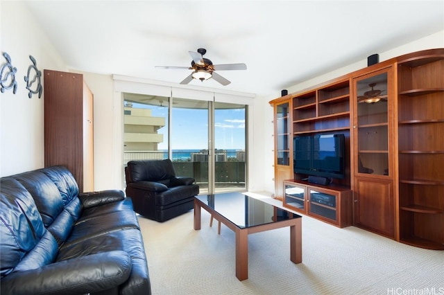 living room featuring light colored carpet and ceiling fan