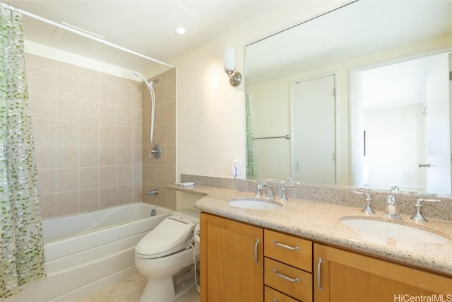 full bathroom with shower / tub combo with curtain, vanity, and toilet