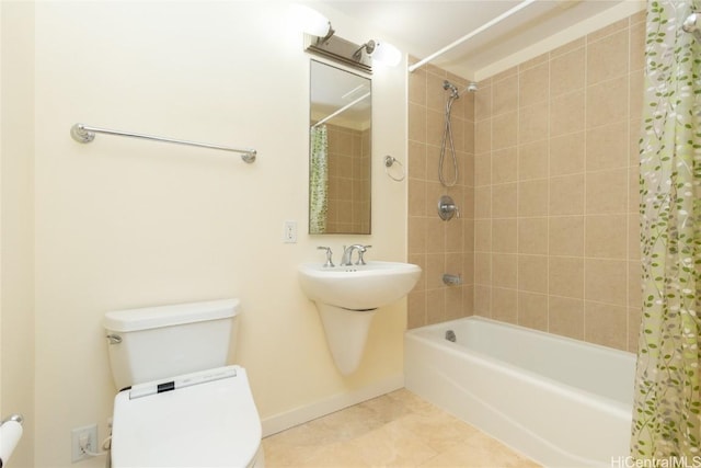 bathroom featuring tile patterned flooring, shower / bath combo, and toilet