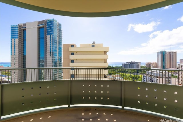 balcony featuring a water view