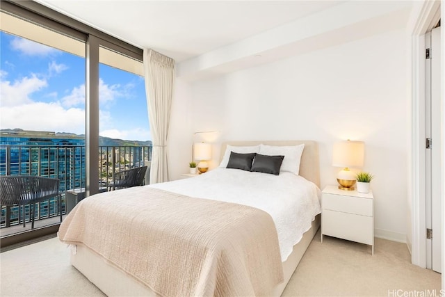 carpeted bedroom featuring access to outside